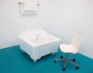 For comfortable procedures, you need a height-adjustable chair with a moisture-resistant covering